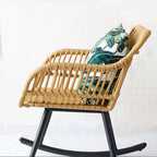 Light honey toned rocking chair hand woven in natural rattan