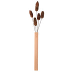 Slim light natural wood wall vase holding a single stem