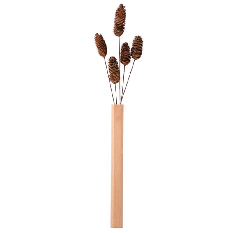 Slim light natural wood wall vase holding a single stem