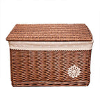 Small woven rattan toy box with a fabric lining and lace trim