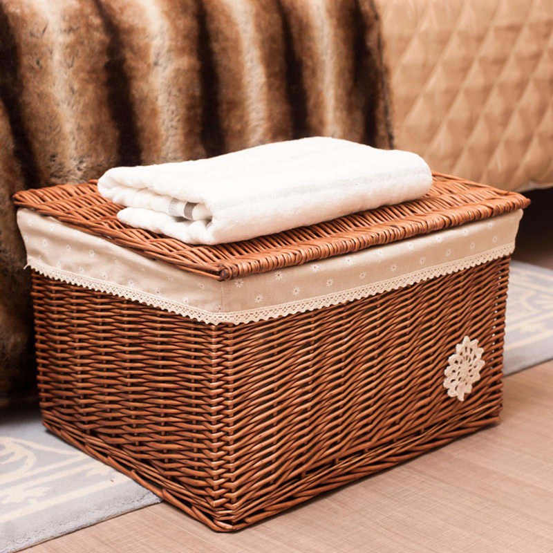 Small woven rattan toy box with a fabric lining and lace trim
