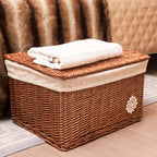 Small woven rattan toy box with a fabric lining and lace trim