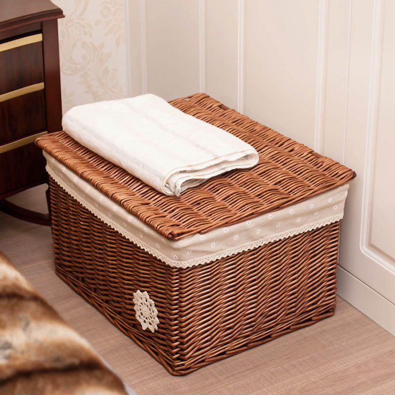 Small woven rattan toy box with a fabric lining and lace trim