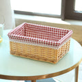Rectangular wicker basket with red gingham cotton liner