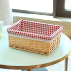 Rectangular wicker basket with red gingham cotton liner