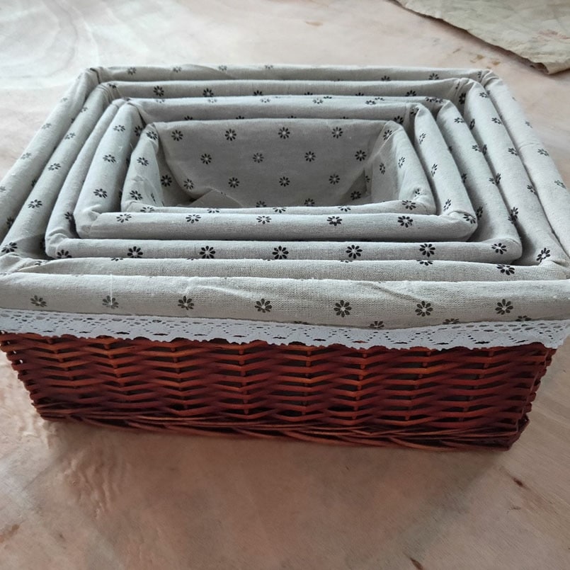 Rectangular wicker basket with red gingham cotton liner