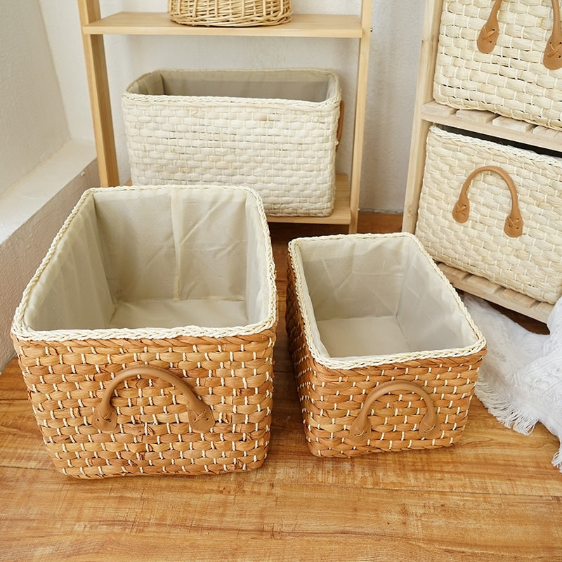 Lined woven storage boxes with handles on shelves