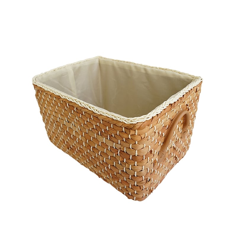 Lined woven storage boxes with handles on shelves