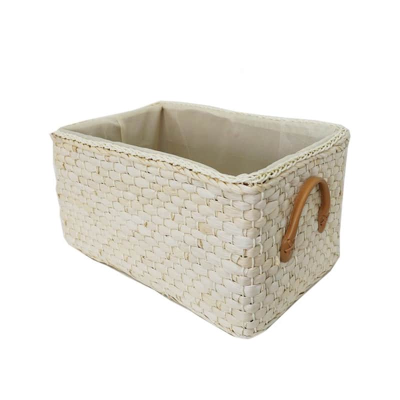 Lined woven storage boxes with handles on shelves