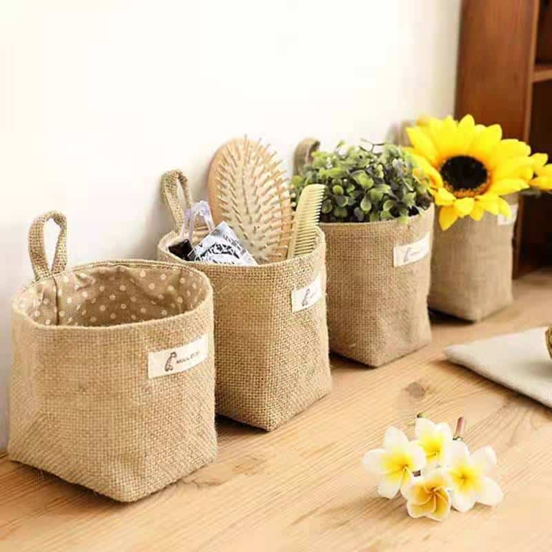 Small linen fabric storage baskets with hanging loops