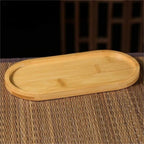 Slim long oval bamboo tray with raised edges