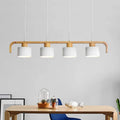 Long linear wood LED pendant light for a dining table
