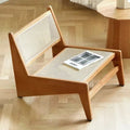 Low enveloping Nordic chair hand woven in natural beige wicker