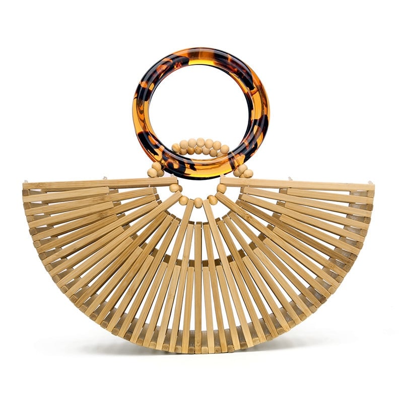 Structured handbag in sculpted natural wood with a hand woven rattan body