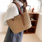 Structured luxe handbag densely hand woven in straw in beige or brown