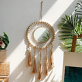 Round mirror with macrame, wood beads and tassels like a dream catcher