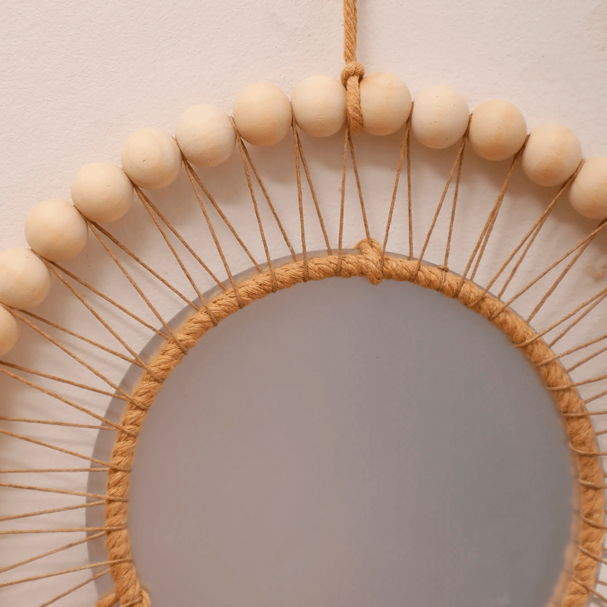 Round mirror with macrame, wood beads and tassels like a dream catcher