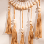Round mirror with macrame, wood beads and tassels like a dream catcher