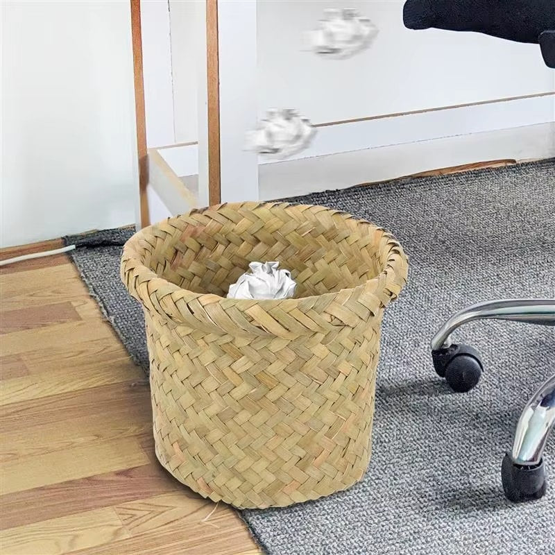 Mini round sand colored rattan wastebasket with a tight weave