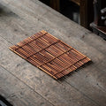 Brown tightly woven bamboo placemat with finely rounded edges