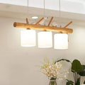 Modern geometric chandelier in brown wood and resin with cut out shapes