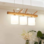 Modern geometric chandelier in brown wood and resin with cut out shapes