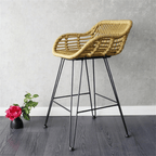 Modern bar chair with a geometric openwork rattan back on matte black metal legs