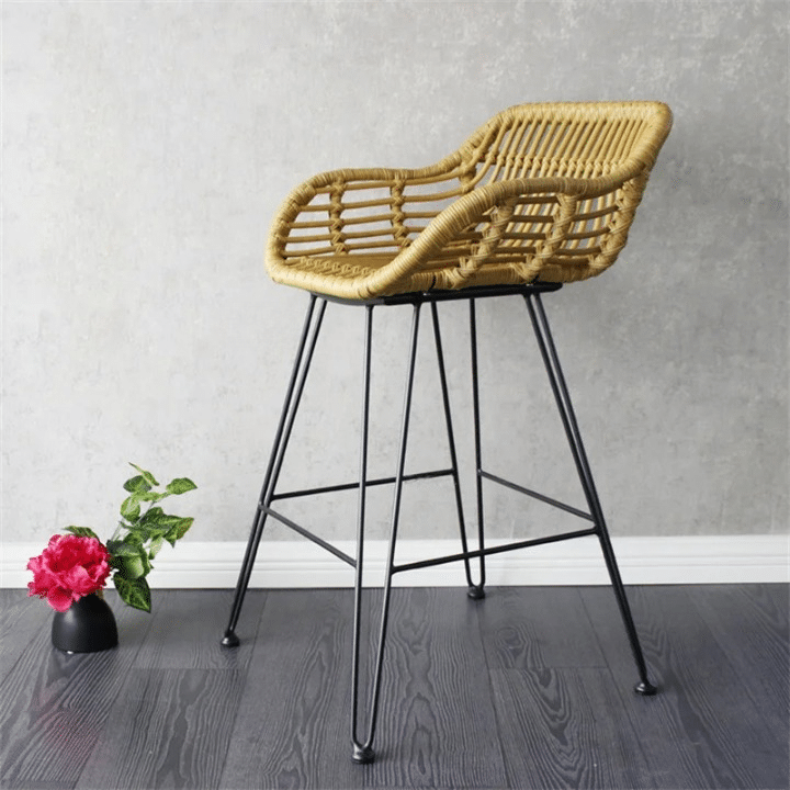 Modern bar chair with a geometric openwork rattan back on matte black metal legs