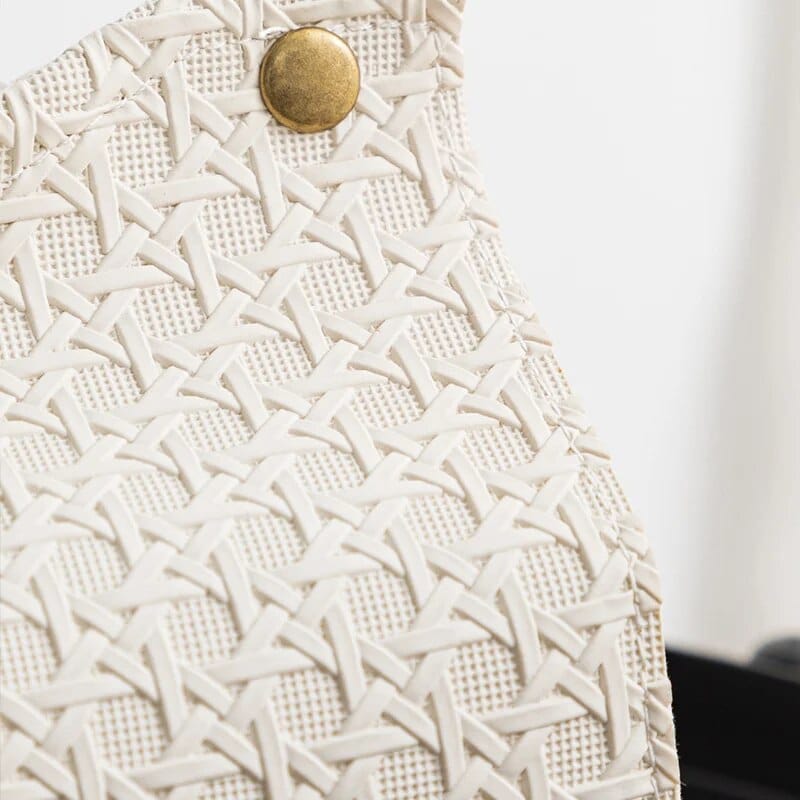 Small hand woven rattan bag with smooth white faux leather trim