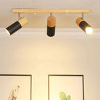 Modern ceiling light with three adjustable heads in wood and black metal