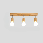 Modern ceiling light with three adjustable heads on a natural wood base