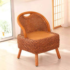 Hand woven wicker stool with a curved backrest on four legs