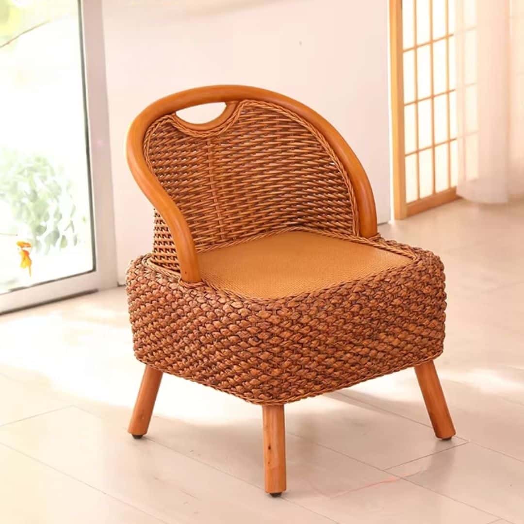 Hand woven wicker stool with a curved backrest on four legs
