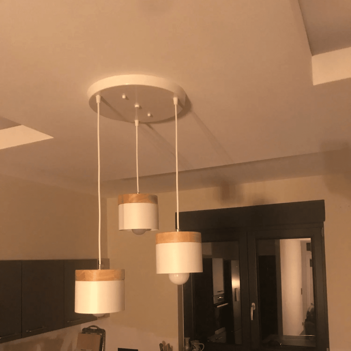 Slim modern pendant light pairing wood and brushed aluminum