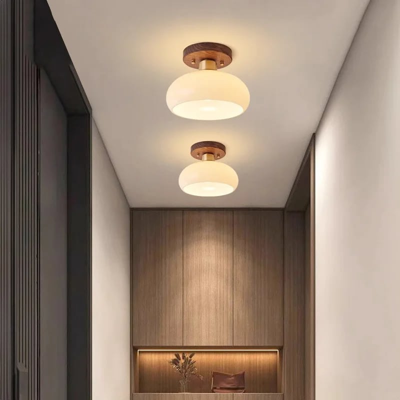 Modern ceiling light with a wood frame and translucent glass stone diffuser