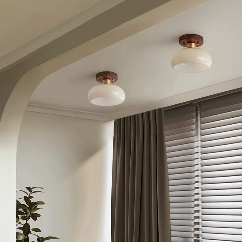 Modern ceiling light with a wood frame and translucent glass stone diffuser