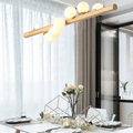 Long modern pendant with a natural wood frame and glass globes