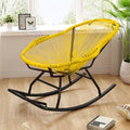 Modern rocking chair hand woven in sunny yellow rattan with generous curves