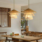 Sculptural pendant made of twisted stacked rattan rings