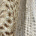 Roll of natural open weave rattan cane webbing