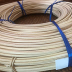 Coil of natural rattan reed core for caning and basketry