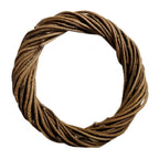 Natural wicker wreath base shown decorated with greenery and dried orange slices