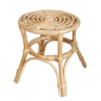 Hand woven natural rattan plant stand holding a potted plant