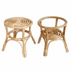 Hand woven natural rattan plant stand holding a potted plant