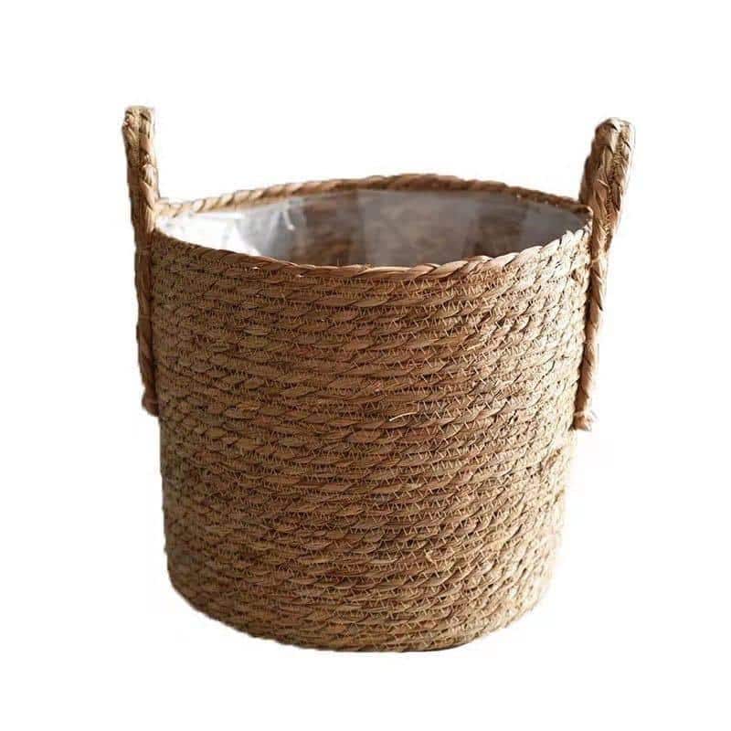 Natural woven storage baskets with handles and plants