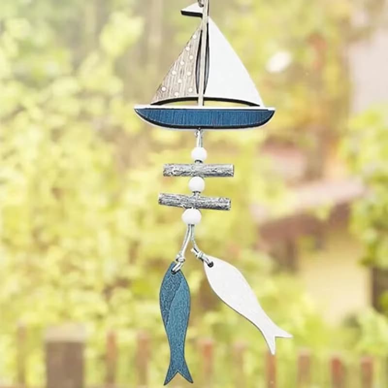 Wooden sailboat wall hanging with driftwood and fish