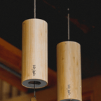 Bamboo cylinder wind chime with a flower shaped wind catcher