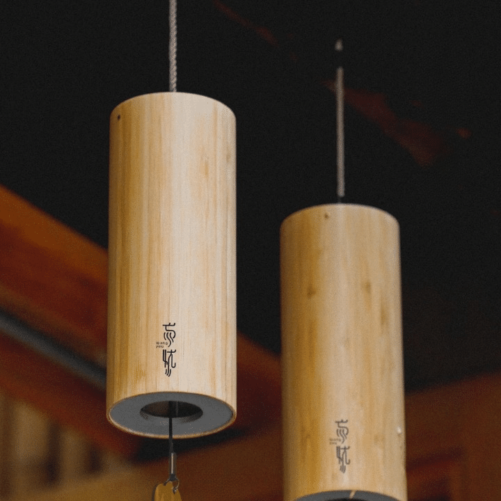 Bamboo cylinder wind chime with a flower shaped wind catcher