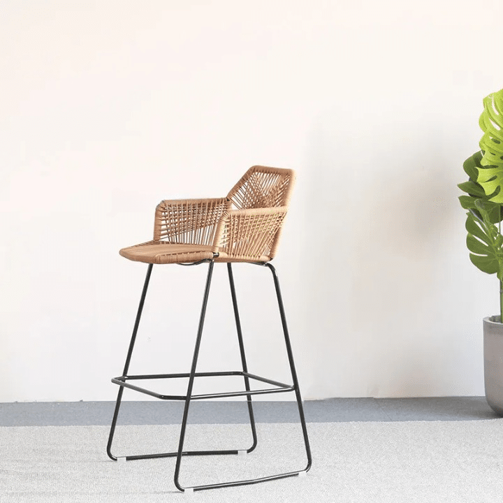 Nordic bar chair with a hand woven rattan seat and back on black metal legs