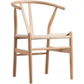 Nordic chair with a clean solid wood frame and a woven wicker look seat